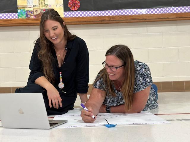 Two female teachers working together